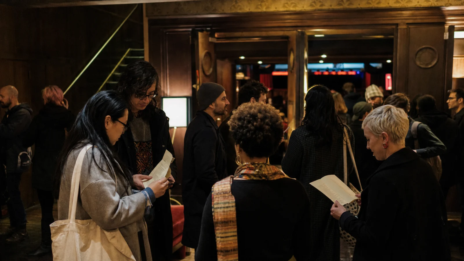 Independent cinema audience gathering before a thoughtful festival screening
